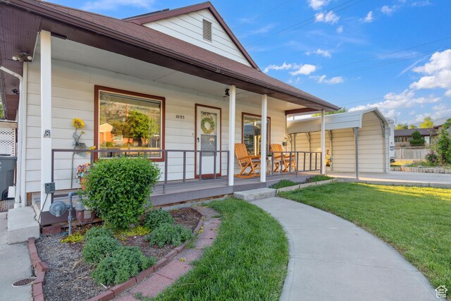 1095 N 100 W, Pleasant Grove, UT 84062 - view of front facade featuring covered porch, a front yard, and roof with shingles