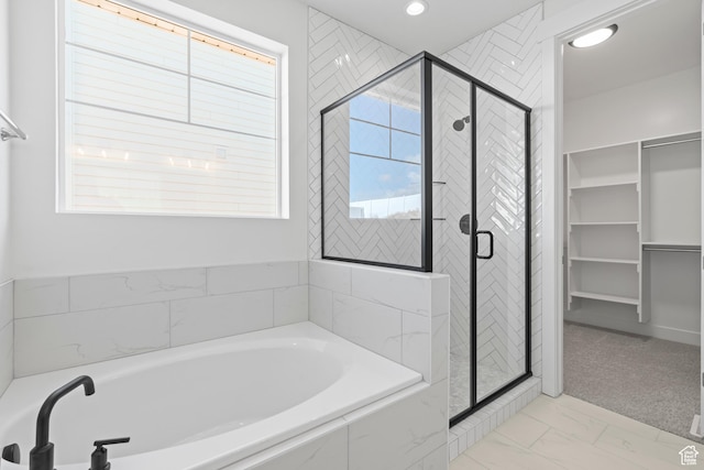 4721 S Taylors View Ln Unit 18, Taylorsville, UT 84123 - bathroom featuring a bath, a shower stall, marble finish floors, recessed lighting, and a walk in closet