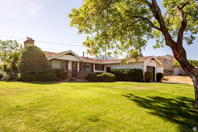 570 N Parkway Ave, Tooele, UT 84074 - single story home with a chimney, an attached garage, and a front lawn
