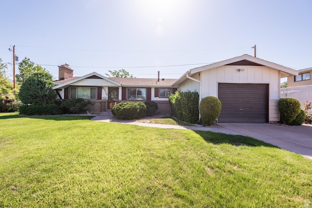 570 N Parkway Ave, Tooele, UT 84074 - ranch-style house featuring concrete driveway, an attached garage, a front yard, and a chimney