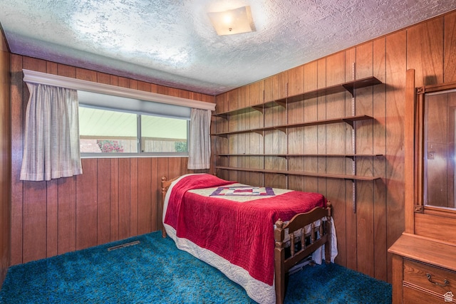 570 N Parkway Ave, Tooele, UT 84074 - carpeted bedroom with wooden walls and a textured ceiling