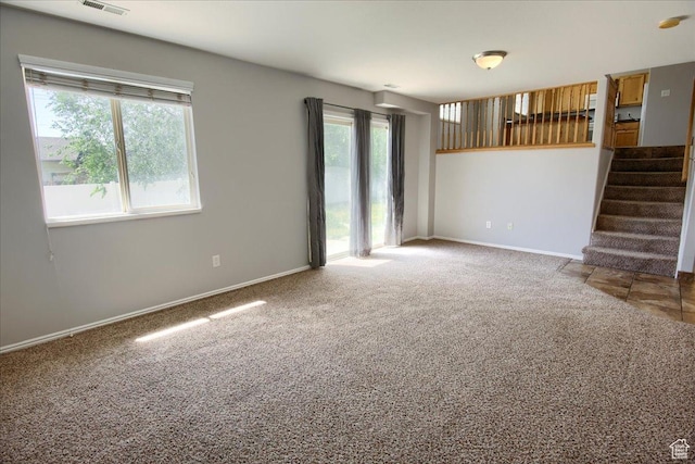 2086 S 50 E, Clearfield, UT 84015 - spare room featuring carpet floors, stairs, and baseboards