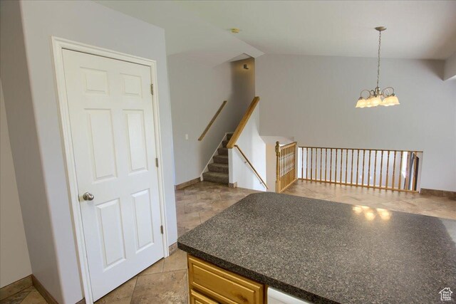 2086 S 50 E, Clearfield, UT 84015 - kitchen featuring a chandelier, dark countertops, decorative light fixtures, and baseboards