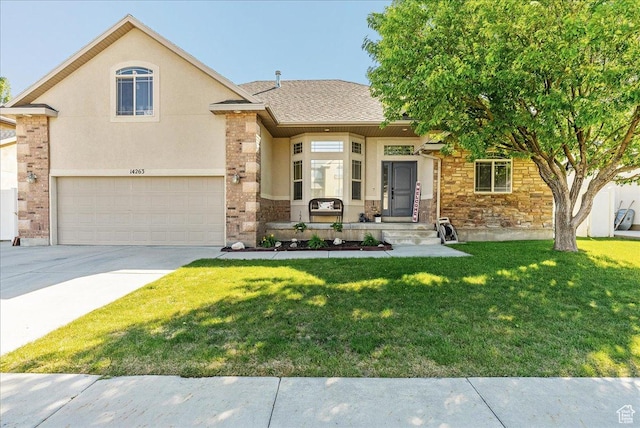 14263 S Morning Light Dr W, Herriman, UT 84065 - view of front of house with concrete driveway, a front yard, an attached garage, stone siding, and stucco siding
