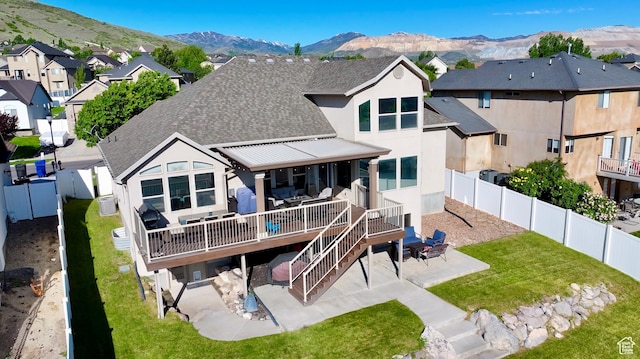 14263 S Morning Light Dr W, Herriman, UT 84065 - rear view of house featuring a patio, roof with shingles, stucco siding, and a residential view