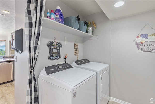 14263 S Morning Light Dr W, Herriman, UT 84065 - washroom with washing machine and dryer and light wood-style floors