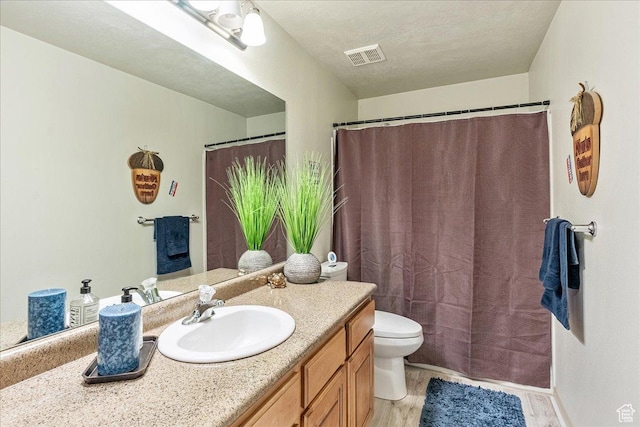 14263 S Morning Light Dr W, Herriman, UT 84065 - full bathroom featuring vanity, toilet, and wood finished floors