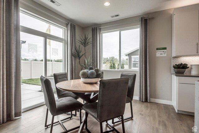 873 S 120 W Unit 003, American Fork, UT 84003 - dining area with healthy amount of natural light, light wood finished floors, recessed lighting, and baseboards