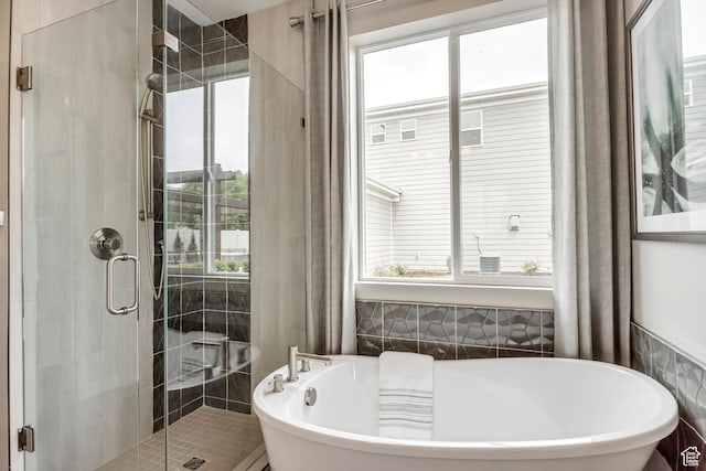 873 S 120 W Unit 003, American Fork, UT 84003 - full bathroom featuring a stall shower, a freestanding tub, and tile walls