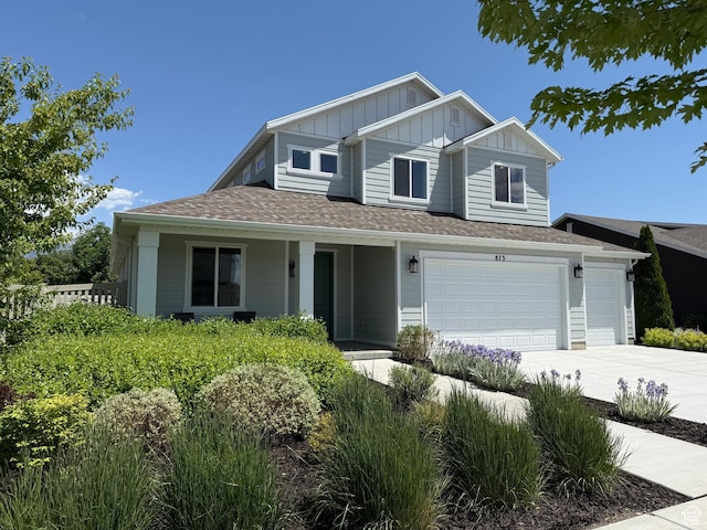 873 S 120 W Unit 003, American Fork, UT 84003 - view of front of home featuring board and batten siding, driveway, a porch, and roof with shingles
