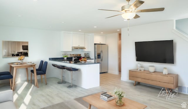 815 N 216 W Unit 23, Nephi, UT 84648 - living room featuring light wood-style floors, a ceiling fan, and recessed lighting