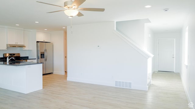 815 N 216 W Unit 23, Nephi, UT 84648 - kitchen featuring stainless steel appliances, under cabinet range hood, a ceiling fan, dark countertops, and light wood finished floors