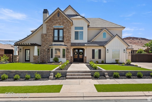 3643 S 2870 E, St George, UT 84790 - craftsman house featuring french doors, board and batten siding, a front lawn, and stone siding