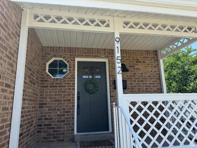 9152 S Cripple Creek Cir W, West Jordan, UT 84088 - property entrance featuring brick siding and covered porch
