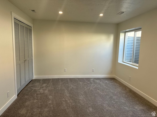 9152 S Cripple Creek Cir W, West Jordan, UT 84088 - unfurnished bedroom with dark colored carpet, baseboards, a closet, and recessed lighting