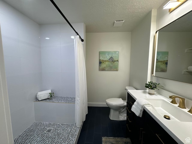 9152 S Cripple Creek Cir W, West Jordan, UT 84088 - full bath with toilet, vanity, tiled shower, and a textured ceiling