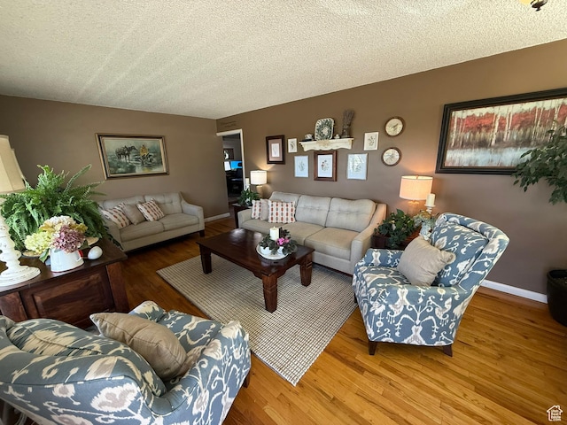 272 E 3000 N, North Ogden, UT 84414 - living room featuring wood finished floors, a textured ceiling, and baseboards