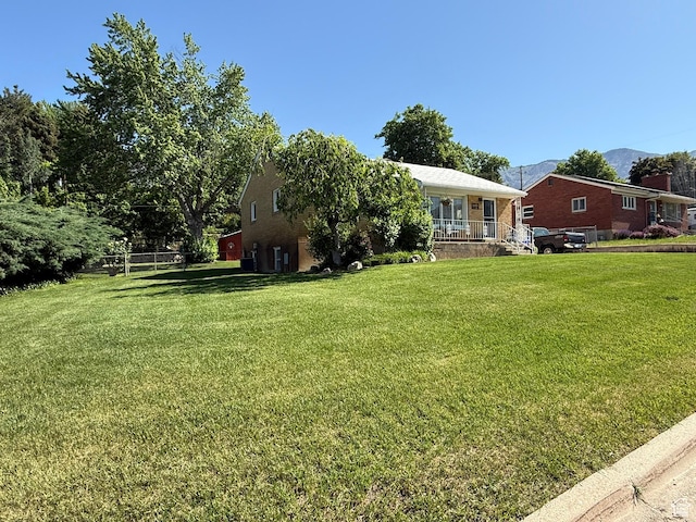272 E 3000 N, North Ogden, UT 84414 - view of front of home featuring a front yard and a mountain view