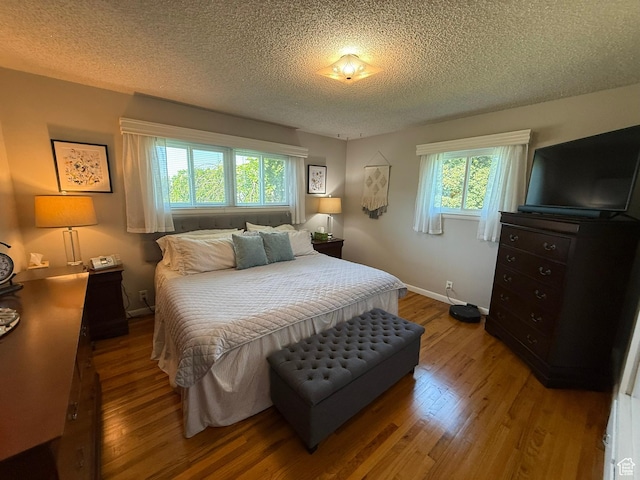 272 E 3000 N, North Ogden, UT 84414 - bedroom featuring wood finished floors, a textured ceiling, and baseboards