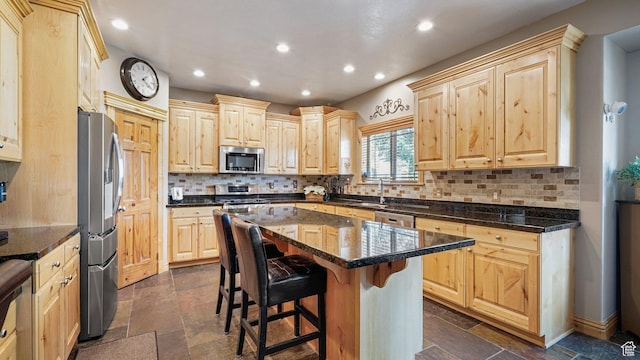 1988 Fieldstone Ln, Heber City, UT 84032 - kitchen with stainless steel appliances, light brown cabinetry, recessed lighting, and stone tile floors