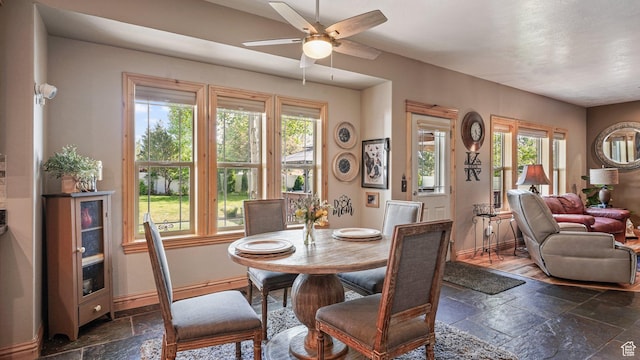 1988 Fieldstone Ln, Heber City, UT 84032 - dining room featuring stone tile floors, plenty of natural light, and a ceiling fan