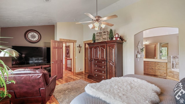 1988 Fieldstone Ln, Heber City, UT 84032 - bedroom featuring light wood-style floors, high vaulted ceiling, arched walkways, a ceiling fan, and ensuite bath