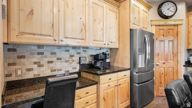 1988 Fieldstone Ln, Heber City, UT 84032 - kitchen with stainless steel fridge, light brown cabinets, tasteful backsplash, and dark stone counters