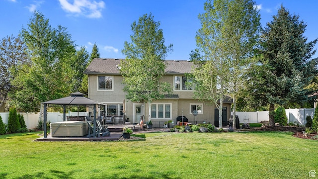 1988 Fieldstone Ln, Heber City, UT 84032 - back of house with a hot tub, a gazebo, stucco siding, and a patio