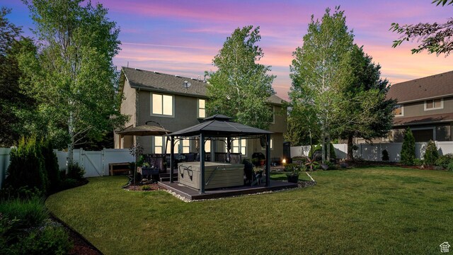 1988 Fieldstone Ln, Heber City, UT 84032 - back of property with a gazebo, a hot tub, and stucco siding