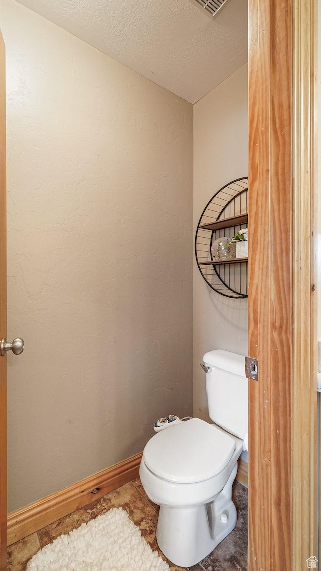 1988 Fieldstone Ln, Heber City, UT 84032 - bathroom with toilet, a textured ceiling, and baseboards