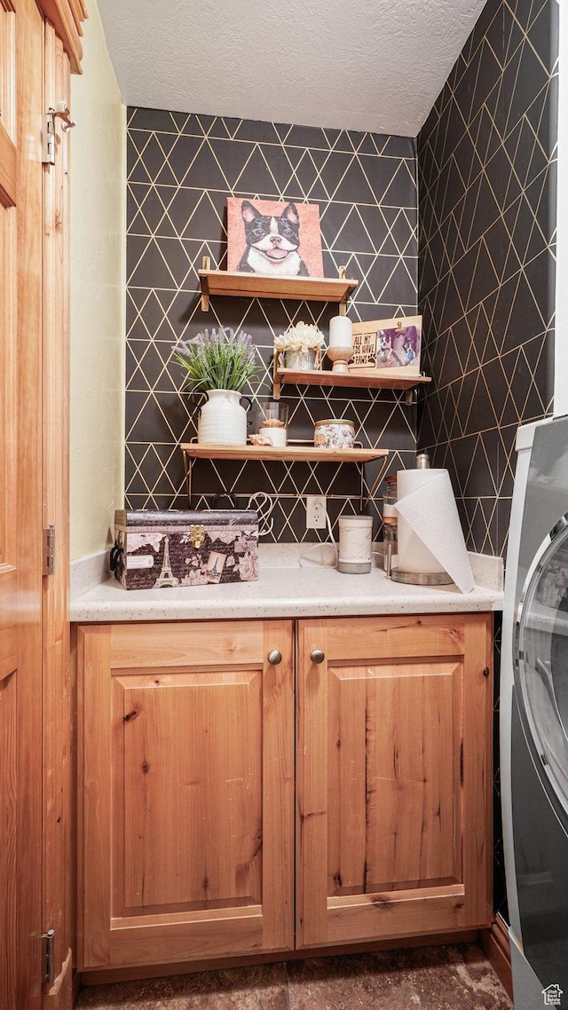 1988 Fieldstone Ln, Heber City, UT 84032 - laundry area featuring cabinet space, washer / dryer, and a textured ceiling