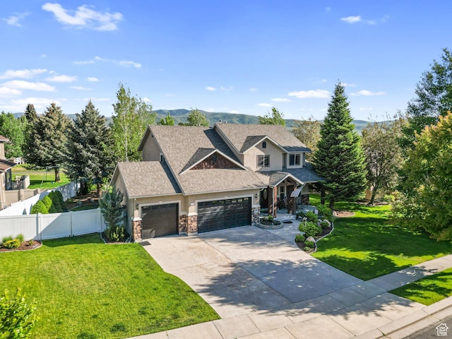 1988 Fieldstone Ln, Heber City, UT 84032 - craftsman inspired home featuring stone siding, an attached garage, driveway, covered porch, and a shingled roof
