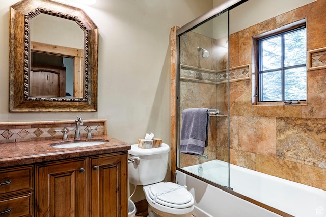 1198 E Elkhorn Ln Unit 2, Oakley, UT 84055 - bathroom featuring toilet, vanity, tasteful backsplash, and enclosed tub / shower combo