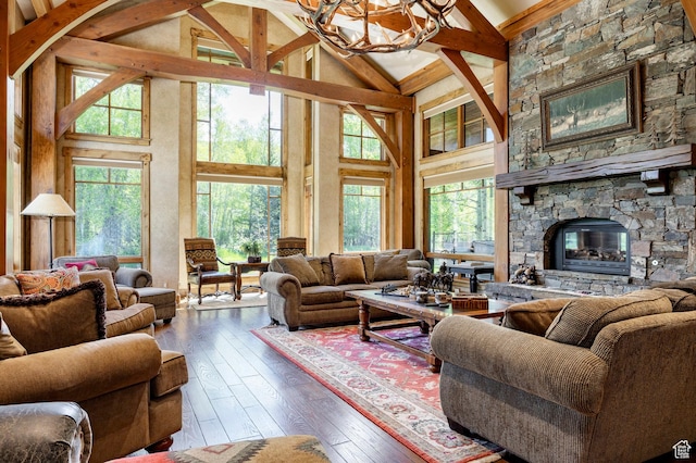 1198 E Elkhorn Ln Unit 2, Oakley, UT 84055 - living area featuring wood-type flooring, a chandelier, high vaulted ceiling, beamed ceiling, and a fireplace