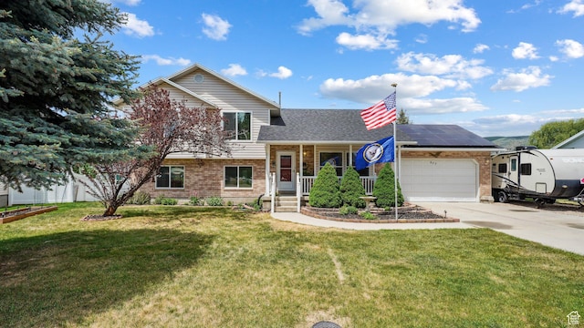 677 E 110 N, Heber City, UT 84032 - tri-level home with brick siding, driveway, a garage, a shingled roof, and solar panels