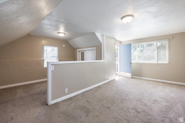 2269 S Green St Unit 1-4, Salt Lake City, UT 84106 - additional living space featuring a textured ceiling, carpet floors, baseboards, and lofted ceiling