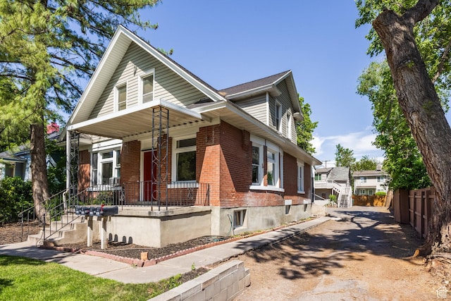 2269 S Green St Unit 1-4, Salt Lake City, UT 84106 - view of side of property with a porch, brick siding, and stairway