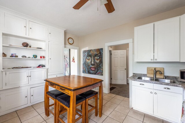 2269 S Green St Unit 1-4, Salt Lake City, UT 84106 - kitchen with a sink, a ceiling fan, light tile patterned floors, and stainless steel microwave