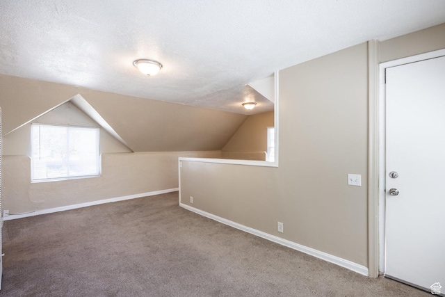 2269 S Green St Unit 1-4, Salt Lake City, UT 84106 - additional living space featuring carpet flooring, baseboards, healthy amount of natural light, and vaulted ceiling