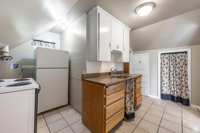 2269 S Green St Unit 1-4, Salt Lake City, UT 84106 - kitchen featuring white appliances, a sink, vaulted ceiling, light tile patterned flooring, and white cabinetry
