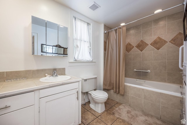 2269 S Green St Unit 1-4, Salt Lake City, UT 84106 - bathroom with vanity, tile patterned floors, tiled shower / bath, and toilet