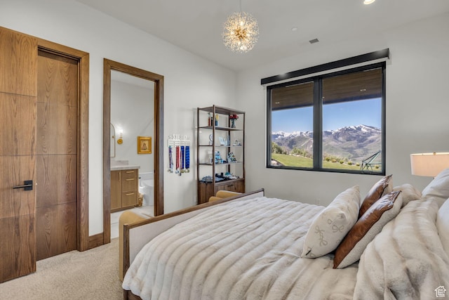 1735 Red Hawk Trl, Park City, UT 84098 - bedroom featuring light colored carpet, a chandelier, and ensuite bathroom