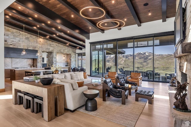 1735 Red Hawk Trl, Park City, UT 84098 - living area featuring wooden ceiling, light wood finished floors, and a chandelier