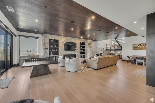 1735 Red Hawk Trl, Park City, UT 84098 - living area featuring stairs, a large fireplace, baseboards, wood finished floors, and recessed lighting