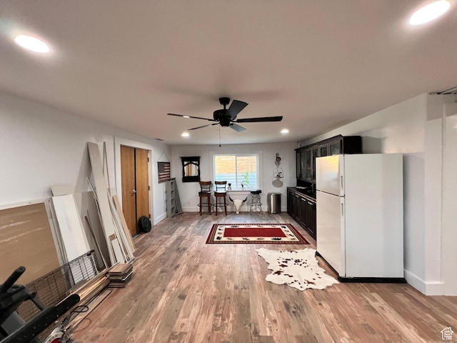 505 W 300 N, Orangeville, UT 84537 - kitchen with freestanding refrigerator, ceiling fan, light wood-style floors, dark cabinetry, and recessed lighting