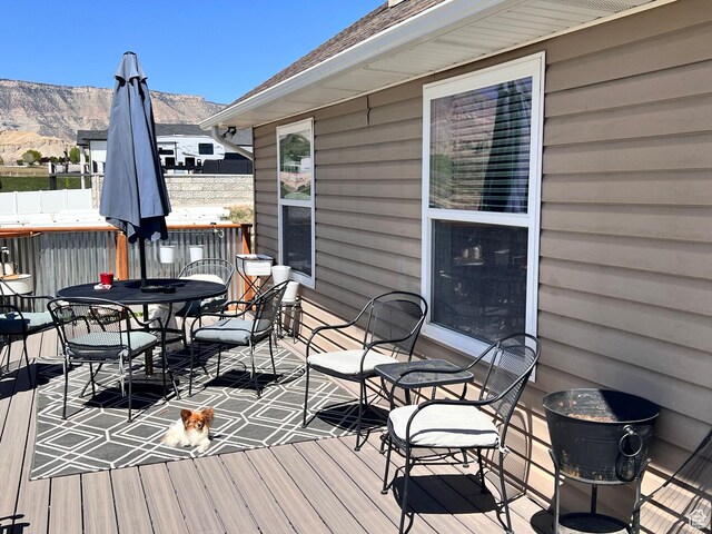 505 W 300 N, Orangeville, UT 84537 - wooden deck with a mountain view and outdoor dining space