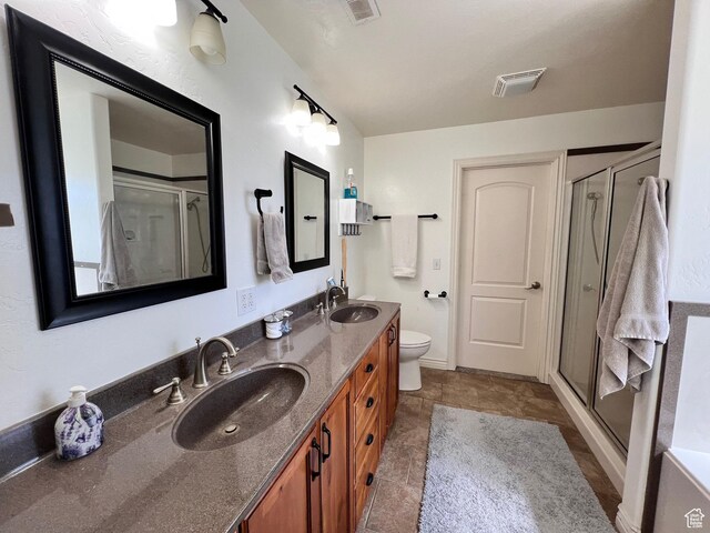 505 W 300 N, Orangeville, UT 84537 - bathroom with double vanity, a stall shower, and toilet