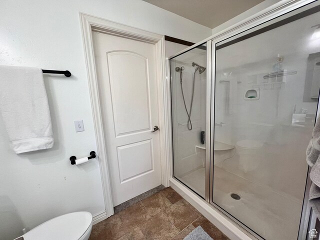 505 W 300 N, Orangeville, UT 84537 - bathroom with toilet, a stall shower, and stone finish flooring