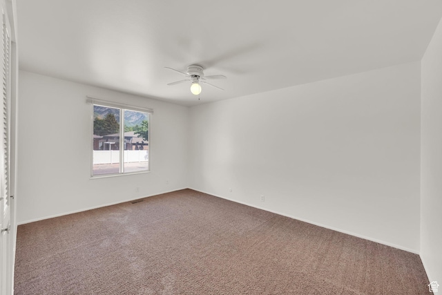8026 S Erique Way, Cottonwood Heights, UT 84093 - carpeted spare room with ceiling fan and baseboards