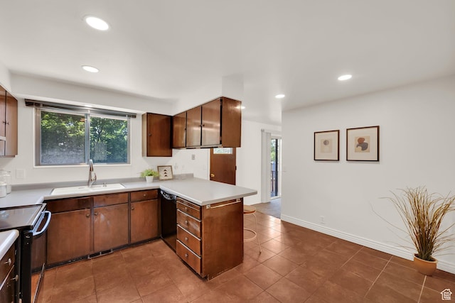 8026 S Erique Way, Cottonwood Heights, UT 84093 - kitchen with black appliances, a sink, a peninsula, light countertops, and plenty of natural light